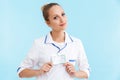 Beautiful blonde woman doctor wearing uniform standing Royalty Free Stock Photo