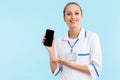 Beautiful blonde woman doctor wearing uniform standing Royalty Free Stock Photo