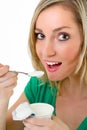 Beautiful blonde woman eating