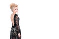 Beautiful blonde woman in elegant black evening dress with updo hairstyle. Lady looking over her shoulder on white Royalty Free Stock Photo