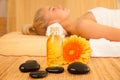 Beautiful blonde woman enyoing massage treatment in sap salon Royalty Free Stock Photo