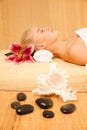 Beautiful blonde woman enyoing massage treatment in sap salon Royalty Free Stock Photo
