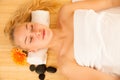 Beautiful blonde woman enyoing massage treatment in sap salon