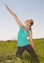 Beautiful blonde woman exercising in the outdoors yoga photo Royalty Free Stock Photo