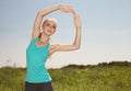 Beautiful blonde woman exercising in the outdoors yoga photo on Royalty Free Stock Photo