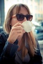 Beautiful blonde woman having breakfast at the bar Royalty Free Stock Photo