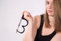 Beautiful blonde woman holding handcuffs. Royalty Free Stock Photo