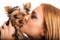 Beautiful blonde woman kissing yorkshire terrier - close up Royalty Free Stock Photo