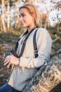 Young woman holding binoculars at sunset Royalty Free Stock Photo