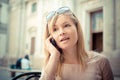 Beautiful blonde woman on the phone at the bar Royalty Free Stock Photo
