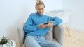 Young woman using smartphone at home.