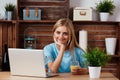 A beautiful blonde woman using laptop computer in Royalty Free Stock Photo