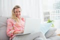 Beautiful blonde woman using laptop Royalty Free Stock Photo