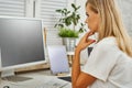 Beautiful blonde woman working on the computer Royalty Free Stock Photo