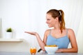 Beautiful blonde young woman eating breakfast Royalty Free Stock Photo