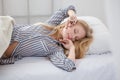 Beautiful blonde young woman sleeping in bed Royalty Free Stock Photo