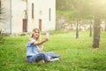 Beautiful blonde young woman taking selfie in a park Royalty Free Stock Photo