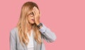 Beautiful blonde young woman wearing business clothes yawning tired covering half face, eye and mouth with hand Royalty Free Stock Photo