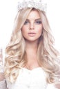 Beautiful blondie girl model in lace wedding dress with curls and crown on her head. beauty face.