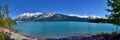 Beautiful blue Abraham Lake with high mountains covered with snow in the background. Royalty Free Stock Photo