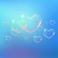 Beautiful blue background with rainbow colored heart-shaped soap bubbles. Vector illustration Royalty Free Stock Photo