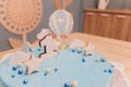 A beautiful blue cake with the number 1 at the top. Beautiful blue cake for baby for 1 year.