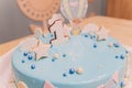 A beautiful blue cake with the number 1 at the top. Beautiful blue cake for baby for 1 year.