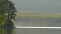 Beautiful blue clear water on the shore of the lake. View of the lake of the woods