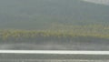 Beautiful blue clear water on the shore of the lake. View of the lake of the woods