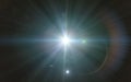 Beautiful blue digital lens flare in black background horizontal Royalty Free Stock Photo