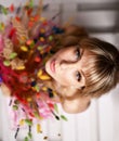 Beautiful blue eyes woman with bouquet of wild flowers closeup portrait Royalty Free Stock Photo