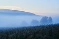 Beautiful blue fog in the morning. Foggy view with trees. Hills of the Beskids, Poland Royalty Free Stock Photo