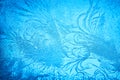 Beautiful blue frost patterns on frozen window as a symbol of Christmas wonder. Christmas or New year background Royalty Free Stock Photo