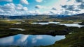 Beautiful blue glacier lakes reflecting the sky in Norwegian national park Royalty Free Stock Photo