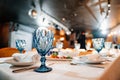 Beautiful blue glass wine glass on the table. Royalty Free Stock Photo