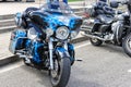 Beautiful blue Harley Davidson motorcycle parked on display on a road
