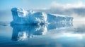 Beautiful blue iceberg in calm Arctic water