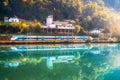 Beautiful blue modern high speed train and river in mountains Royalty Free Stock Photo