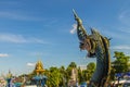 Beautiful blue naga sculpture with blue sky and white cloud on t