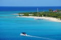 Beautiful blue ocean, boats and white sandy beaches along the bay near Grand Turk, Turks & Caicos