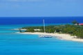Beautiful blue ocean, a yacht and white sandy beaches along the bay near Grand Turk, Turks & Caicos