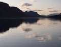 Beautiful beautiful blue orange sunset over the lake Lulealven in Saltoluokta in Sweden Lapland. Reflection of mountains Royalty Free Stock Photo