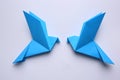 Beautiful blue origami birds on white background, flat lay Royalty Free Stock Photo