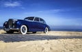 Beautiful blue retro car on the coast