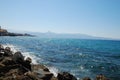 Beautiful blue sea and playful waves under the blue sky