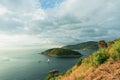 Beautiful blue sea, tourist boat on the island, Sky is cloudy with the light brightness of sunset at Promthep Cape, Phuket, Royalty Free Stock Photo