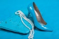 Beautiful blue shoes and handbag, pearls Royalty Free Stock Photo
