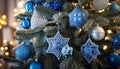Beautiful blue and silver ornaments on Christmas tree create festive atmosphere Royalty Free Stock Photo