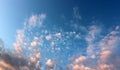 Beautiful blue skies with puffy pink clouds welcome in the morning Royalty Free Stock Photo