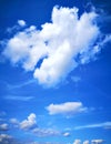 Beautiful blue sky background with white fluffy clouds. Weightlessness, lightness, height and freedom.